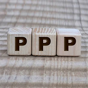 photo of 3 dice with the letter P on them spelling out PPP
