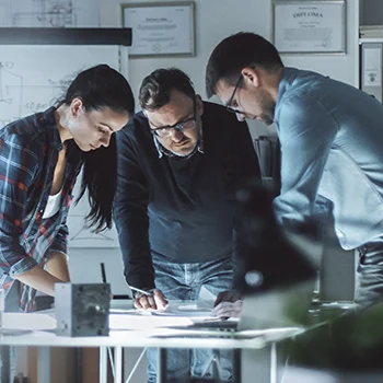 photo of business people having a discussion around a table